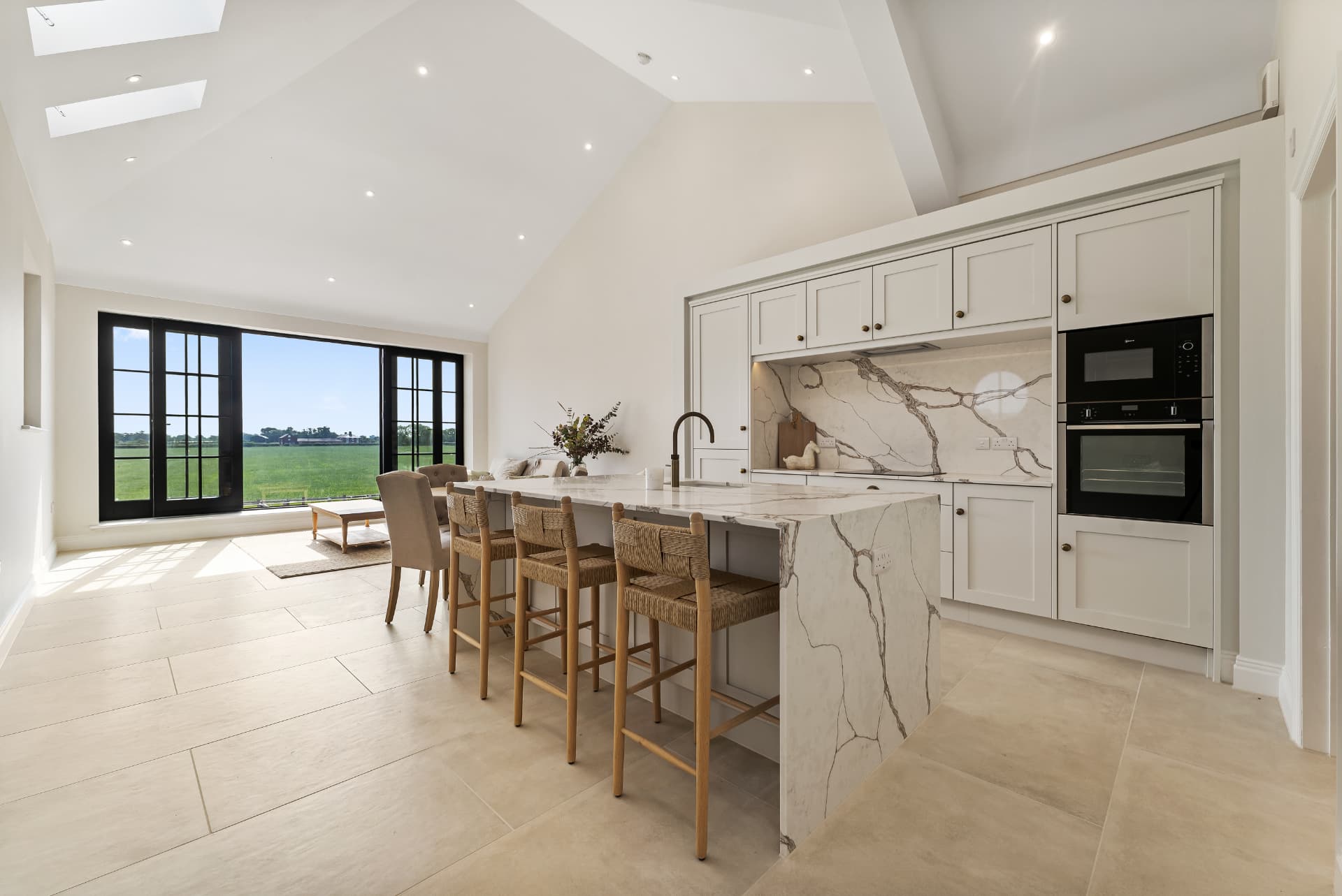 The kitchen at The Barns, with doors opening onto the Cheshire countryside